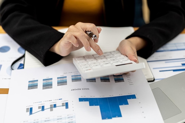 The company's finance manager is using a calculator, he uses a calculator to calculate the numbers in the company's financial documents that employees in the department create as meeting documents.