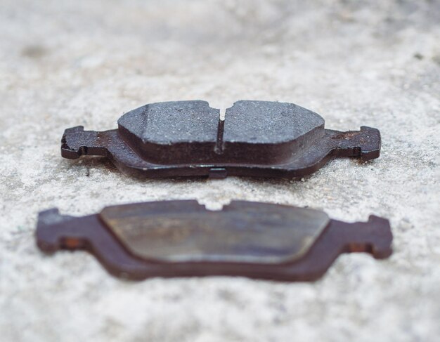 Comparing new and old worn brake pads from car braking system\
lack of proper maintenance of the car can lead to an accident