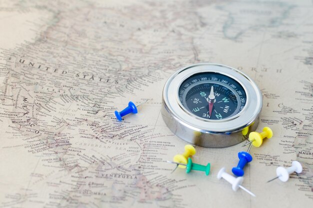 Compass and buttons on the old map closeup