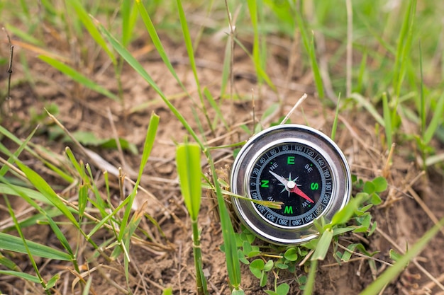 Compass in the grass orientation and journey concepts