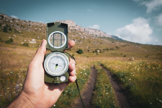 Compass in hand find way destination