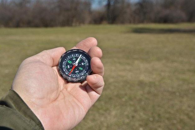 Compass in the hand on a walk