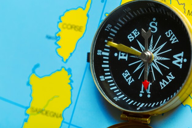 Photo compass on map background travel