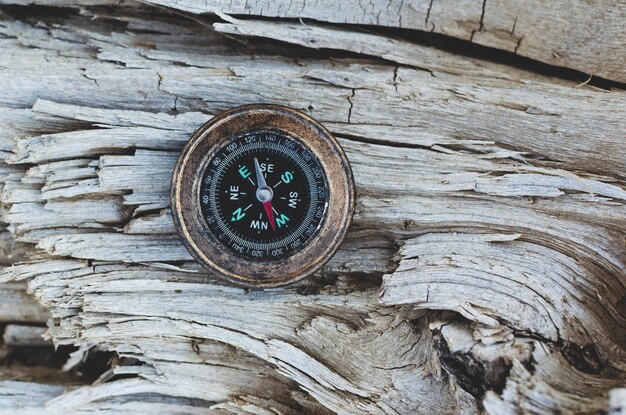 Compass on old wood texture backgroundCamping and camping