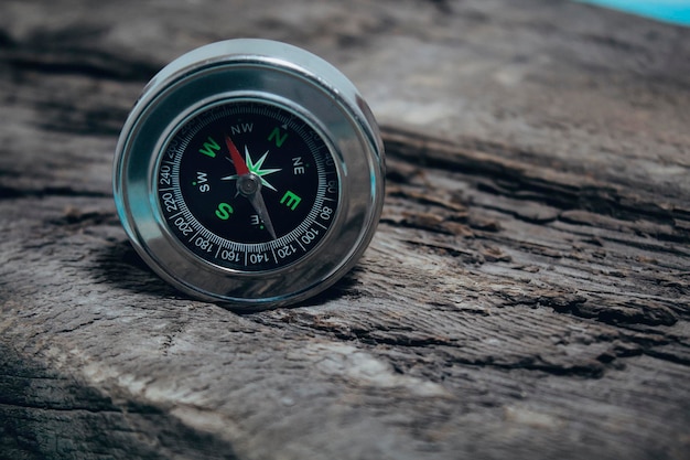 Compass on an old wooden table