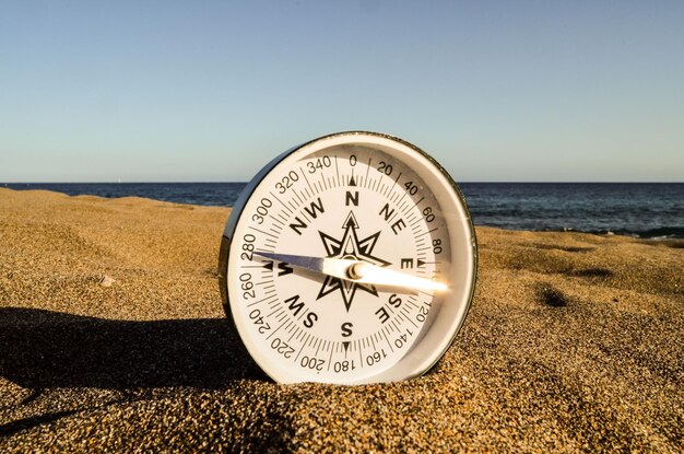 Photo compass on the sand beach