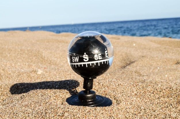 Compass on the Sand Beach