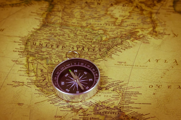 Compass on a vintage world map Retro style