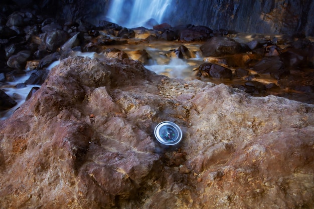 Compass at the waterfall