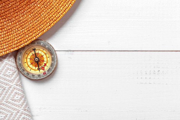 Compass on white wooden table 