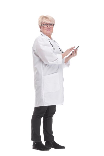 Competent doctor using a digital tablet isolated on a white