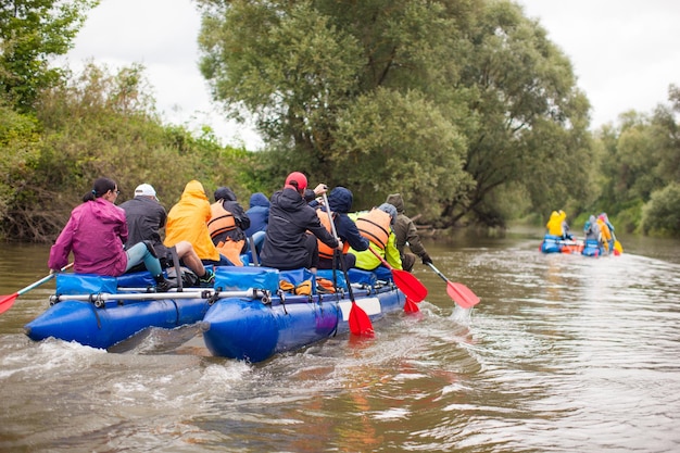 Competition of teams on catamarans on the river rafting