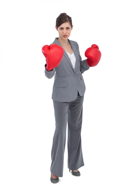 Competitive woman with red boxing gloves