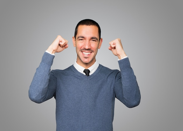 Competitive young man making a gesture of celebration