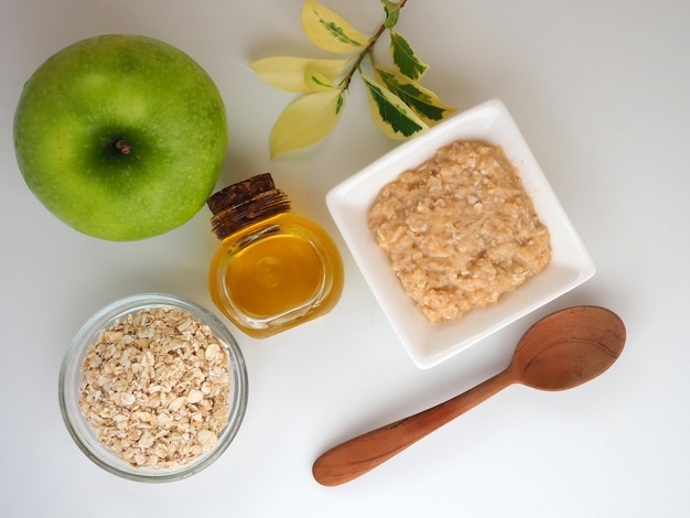 Components of homemade face mask oatmeal green apple olive or almond oil