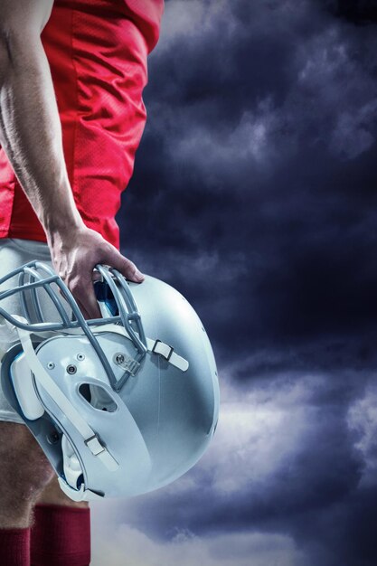 Photo composite image of american football player holding helmet