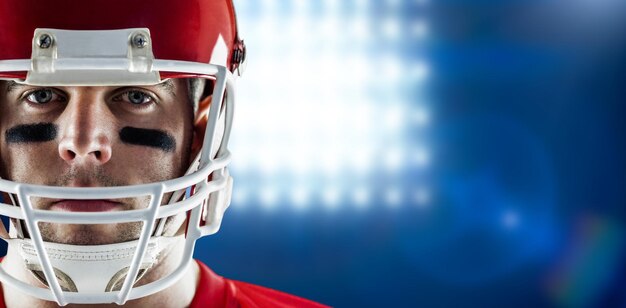 Composite image of american football player looking at camera