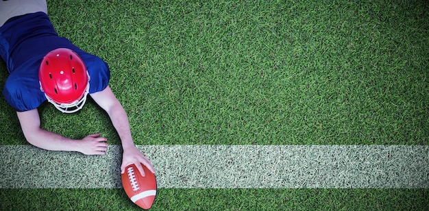 Composite image of american football player scoring a touchdown