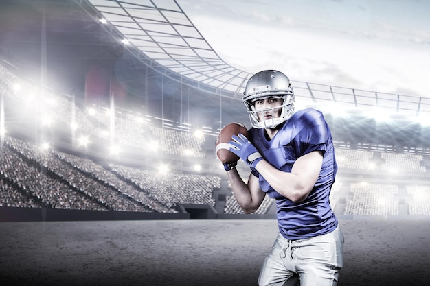 Immagine composita del giocatore di football americano che lancia la palla su sfondo nero