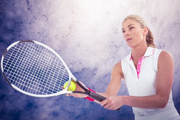 Composite image of athlete playing tennis with a racket