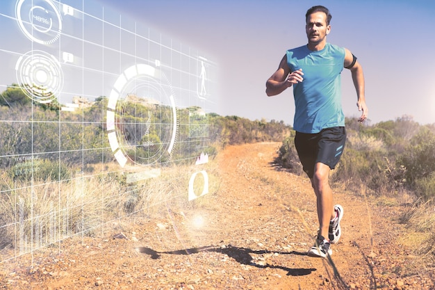 Composite image of athletic man jogging on country trail