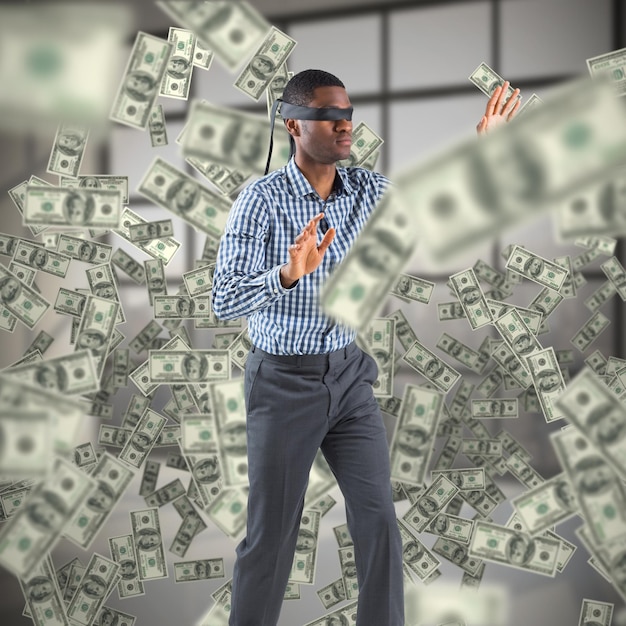 composite image of blindfolded businessman with arms out
