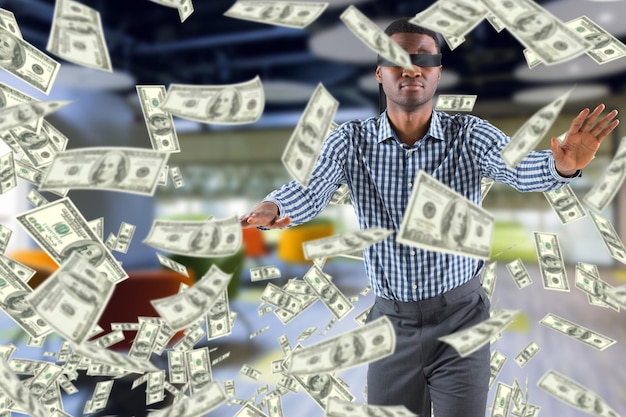 Photo composite image of blindfolded businessman with arms out