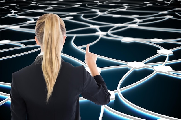 Photo composite image of blonde business woman pointing somewhere