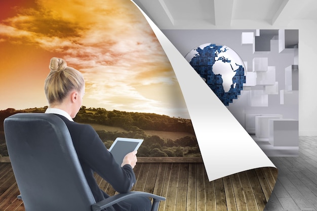 Composite image of blonde businesswoman sitting on swivel chair with tablet