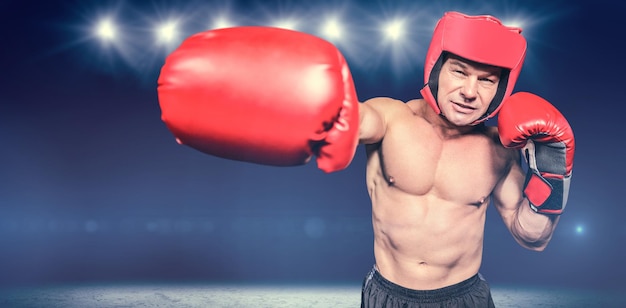 Composite image of boxer punching against black background