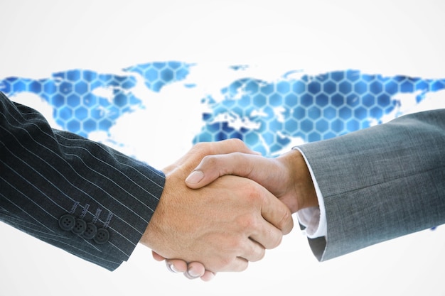 Photo composite image of business handshake against background with hexagons and world map