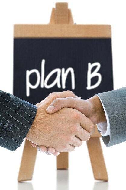 Composite image of business handshake against plan b written on a chalkboard