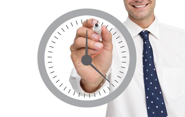 Composite image of business person drawing a clock on white background