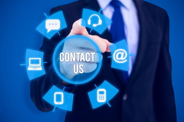 composite image of businessman pointing his finger at camera