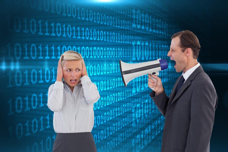 Photo composite image of businessman shouting at colleague with his bullhorn