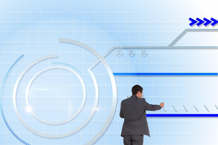 फोटो composite image of businessman standing on ladder writing