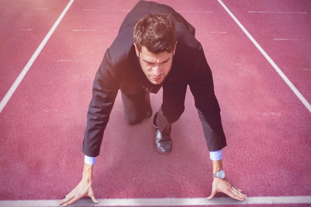 Photo composite image of businessman in the starting blocks