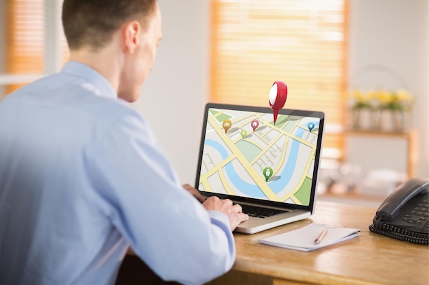 Photo composite image of businessman working on his laptop