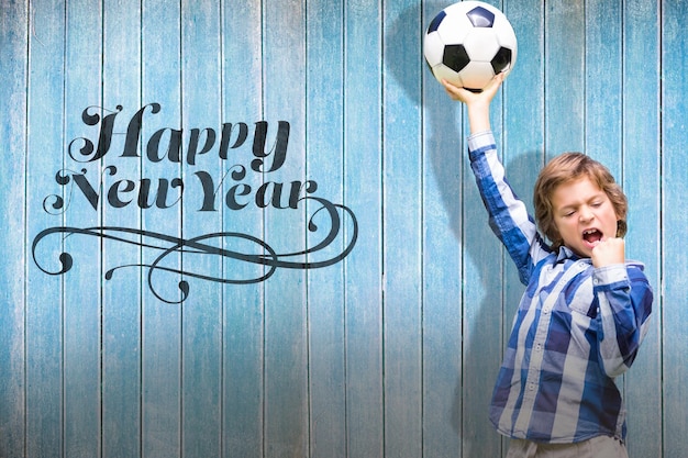 Foto immagine composita del bambino con pallone da calcio