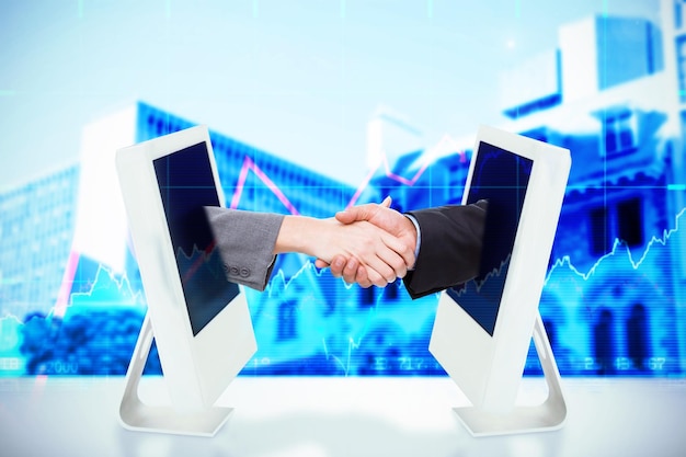 Composite image of close up of two businesspeople shaking their hands