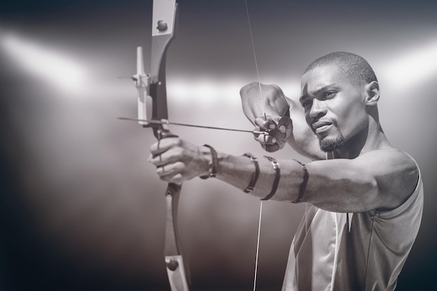 Composite image of close up view of man practicing archery