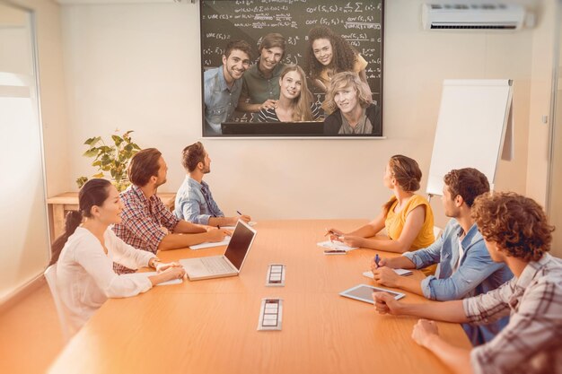 Composite image of college students using computer