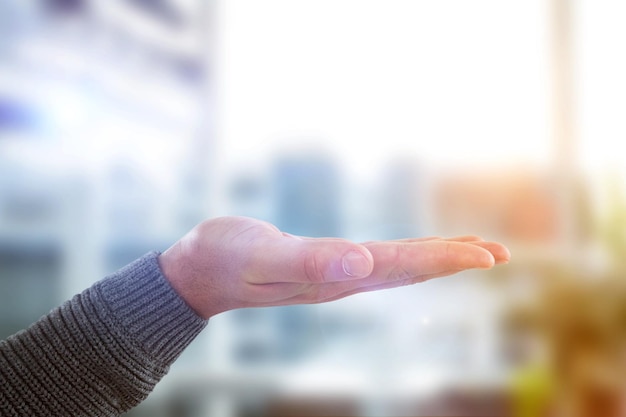 Composite image of cropped hand of man showing hand