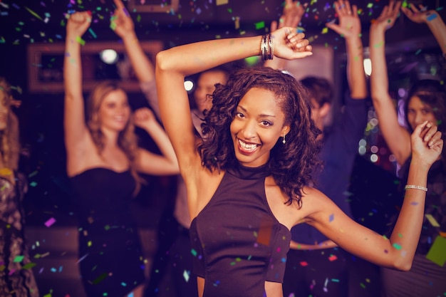 Composite image of cute friends having fun and dancing