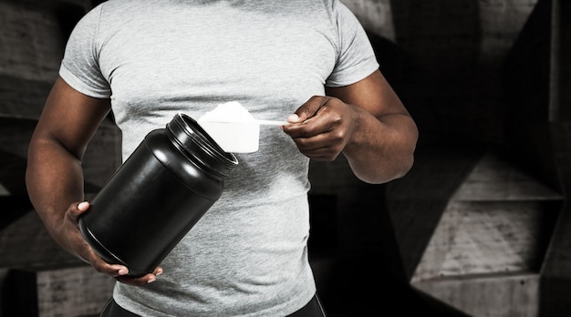 Composite image of fit man scooping protein powder