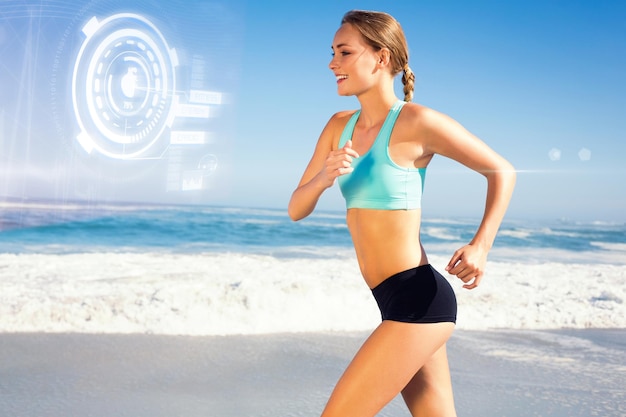 Composite image of fit woman jogging on the beach