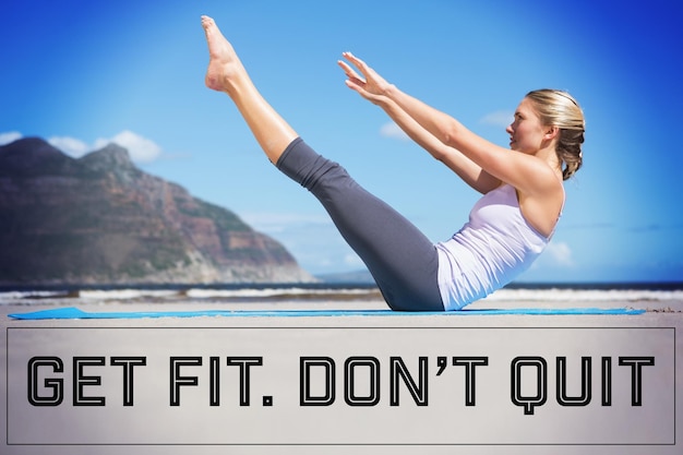 Composite image of focused fit blonde doing yoga on the beach