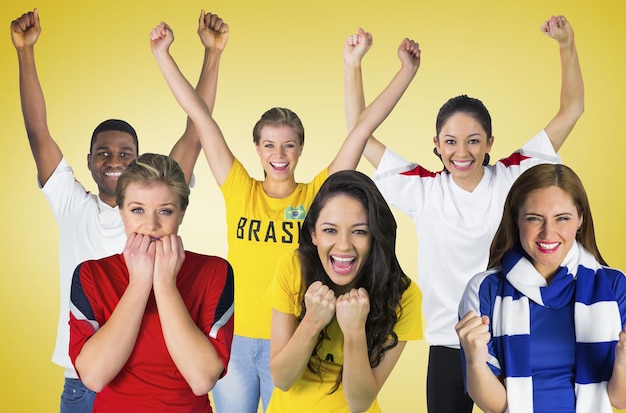 Составное изображение футбольных болельщиков против желтой виньетки
