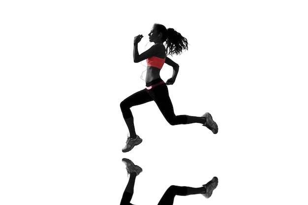 Composite image of full length of healthy woman jogging