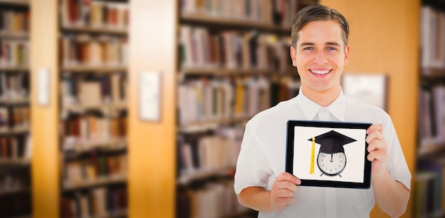 Composite image of geeky businessman showing his tablet pc